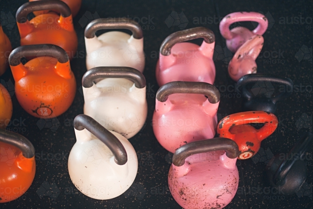 Colourful weights in an indoor gym - Australian Stock Image