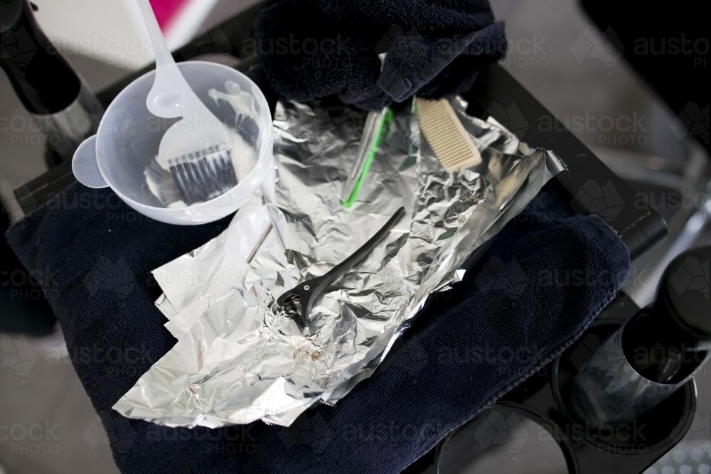 Comb, brush, foil and hair clip used by a hairdresser - Australian Stock Image
