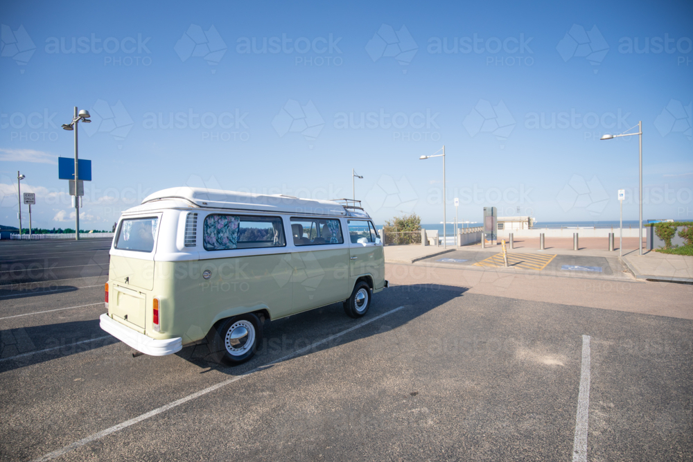 Combi van in car park by the sea on a coastal road trip - Australian Stock Image