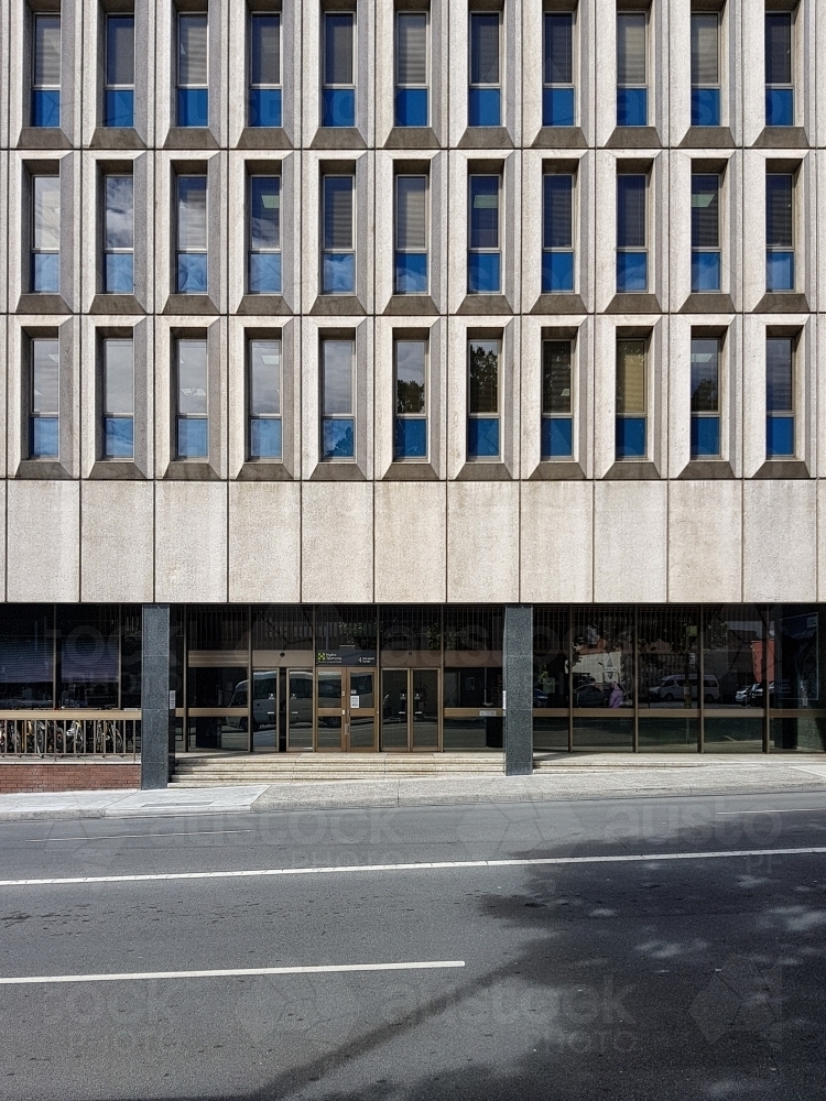 Concrete building facade with windows - Australian Stock Image