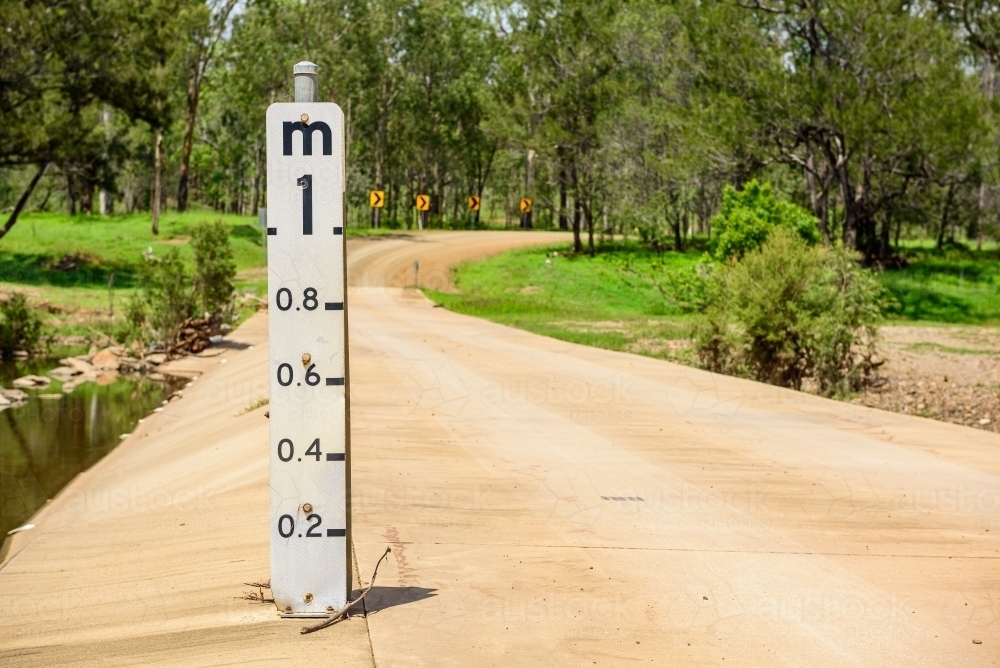 Concrete flood way with water level gauge in Queensland, Australia - Australian Stock Image