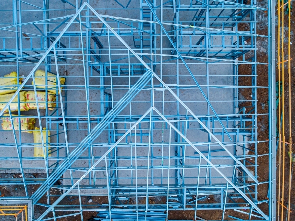 Concrete slab & metal framework of residential house under construction - Australian Stock Image