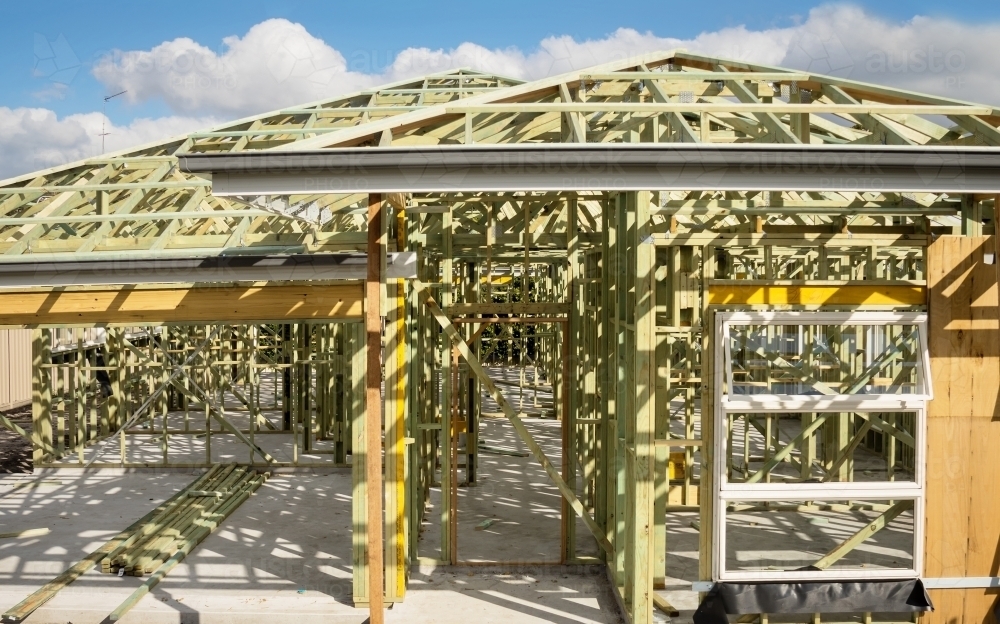 Concrete slab & timber framework of residential house under construction - Australian Stock Image
