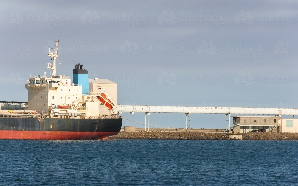 Container ship and pipeline at a port - Australian Stock Image