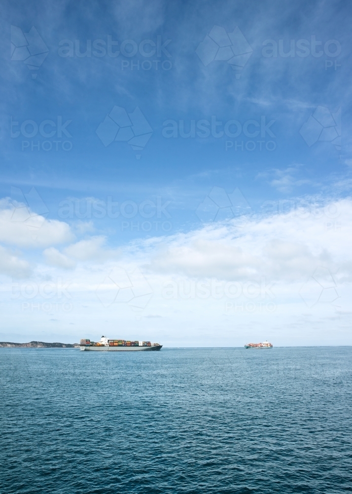 Container ships passing each other at the heads - Australian Stock Image