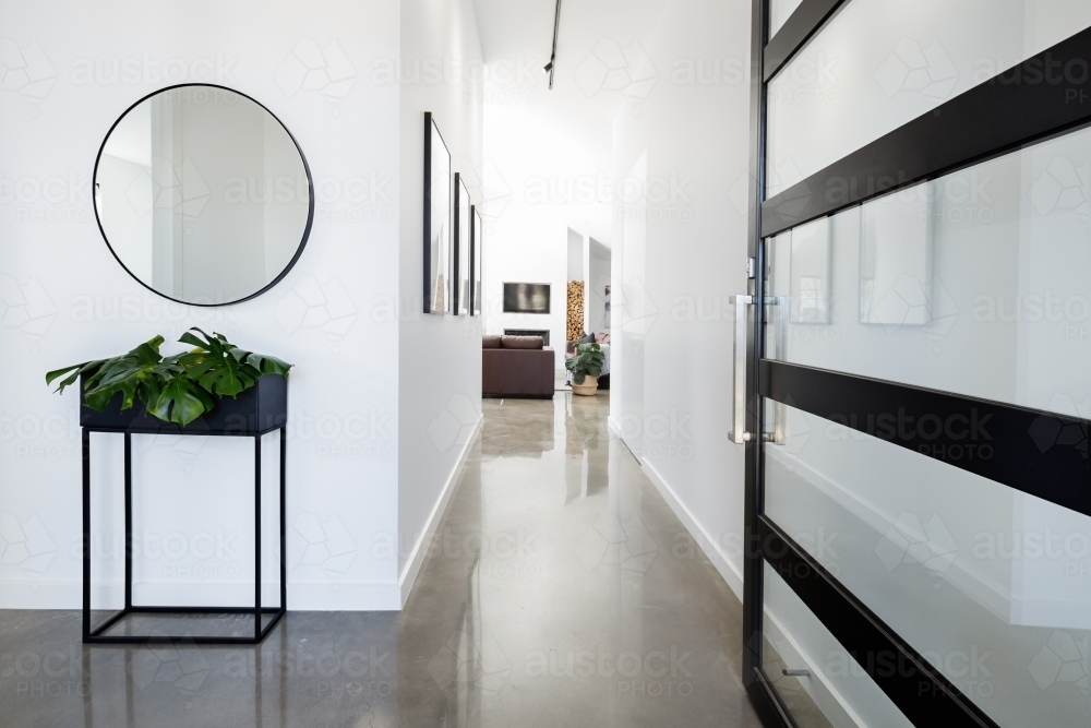 Contemporary home entry with polished concrete floors - Australian Stock Image