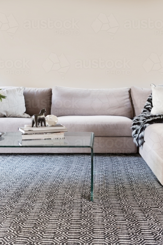 Contemporary living room sofa with blank wall for your artwork - Australian Stock Image
