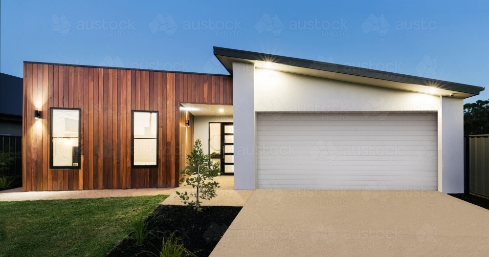 Contemporary new home lighting at dusk - Australian Stock Image