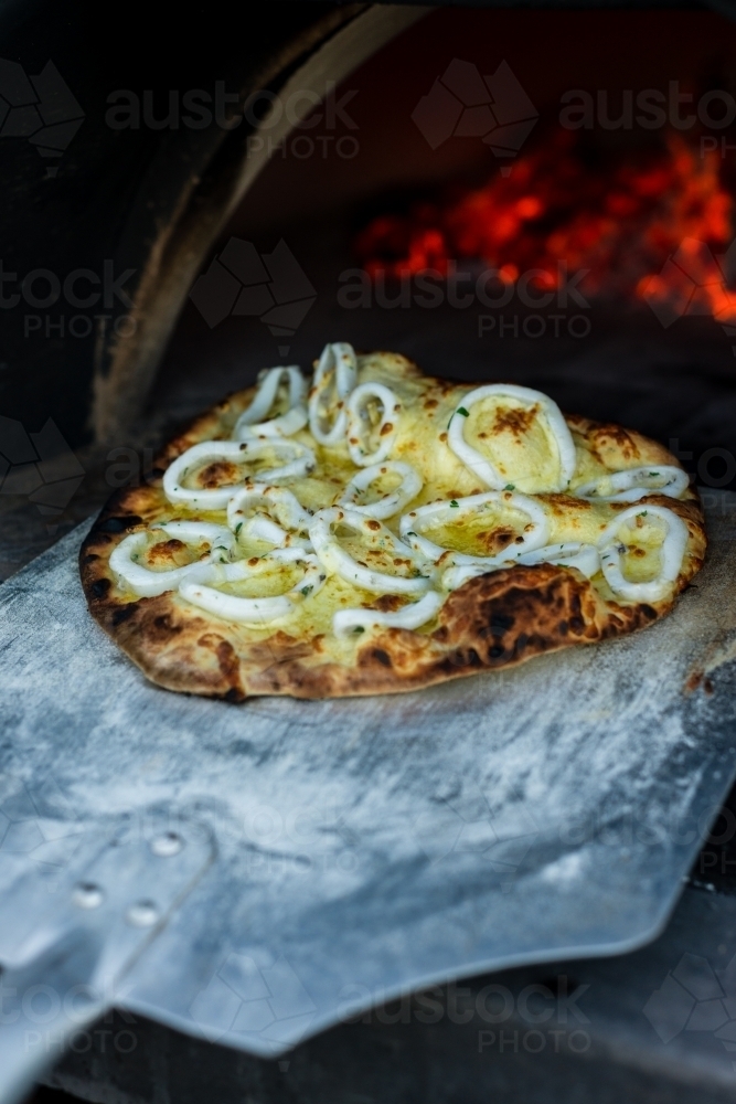 cooked pizza with squid - Australian Stock Image