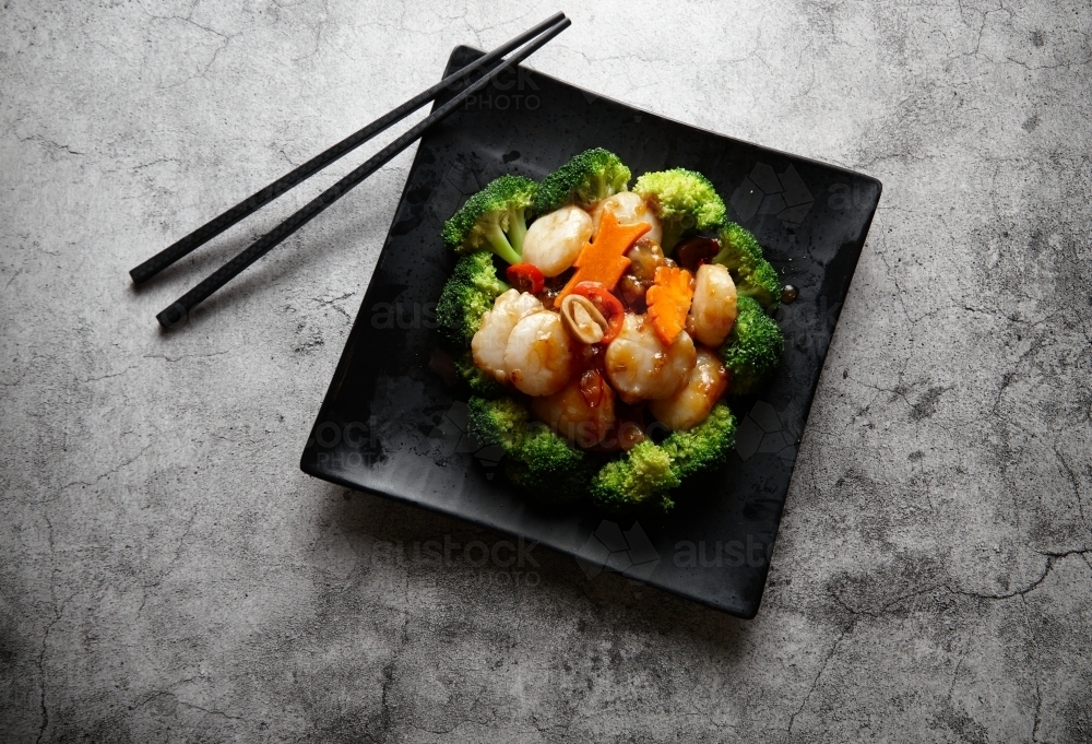 Cooked prawns and vegetables on plate - Australian Stock Image