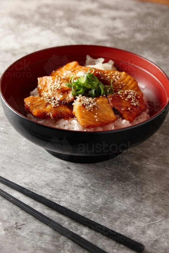 Cooked salmon noodle dish in bowl - Australian Stock Image