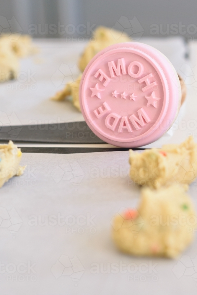 cookie dough on trays with home made stamp - Australian Stock Image