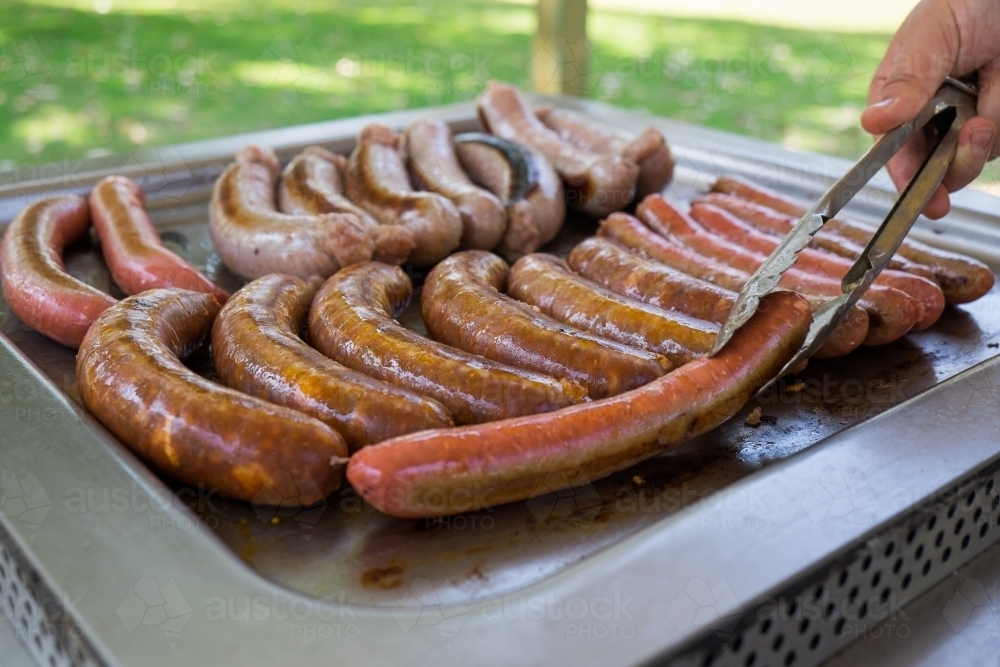 Image of Cooking sausages on a barbecue Austockphoto