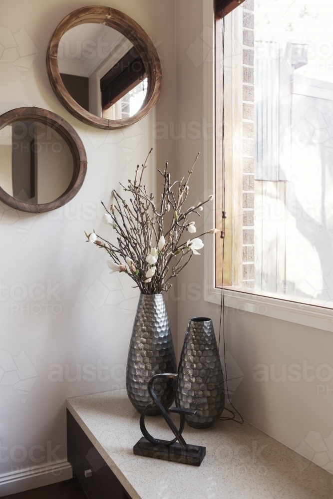 Corner decor details of vase and wall mirrors - Australian Stock Image