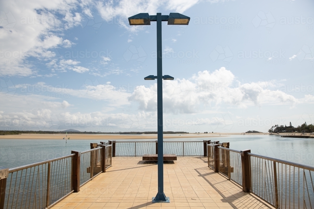 Cotton Tree Jetty in sunshine and blue sky - Australian Stock Image