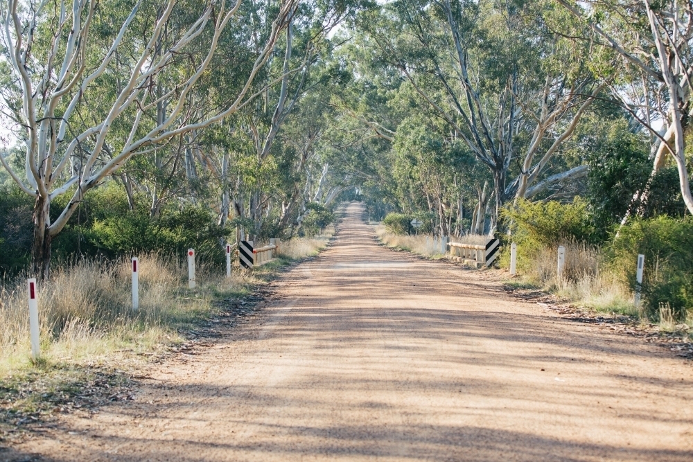 Country dirt road that goes off over horizon - Australian Stock Image