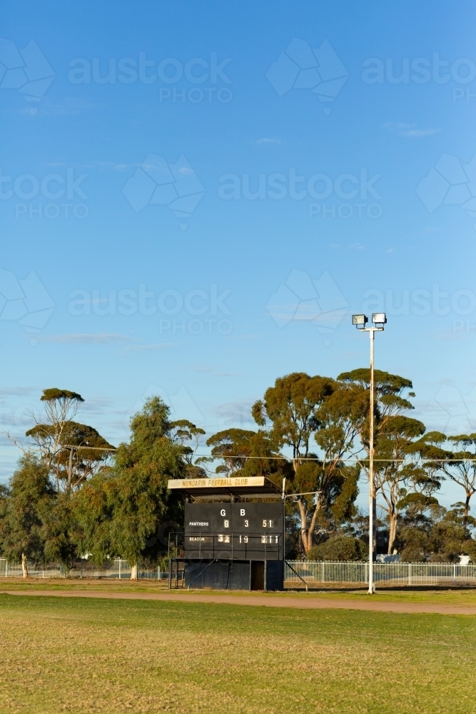 country football oval with scoreboard - Australian Stock Image