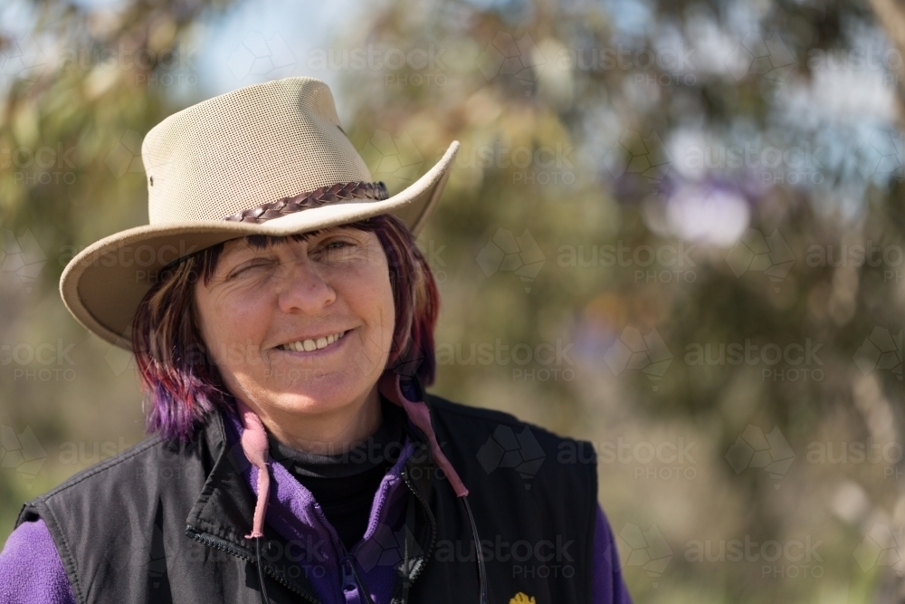 Country lady winking and smiling - Australian Stock Image