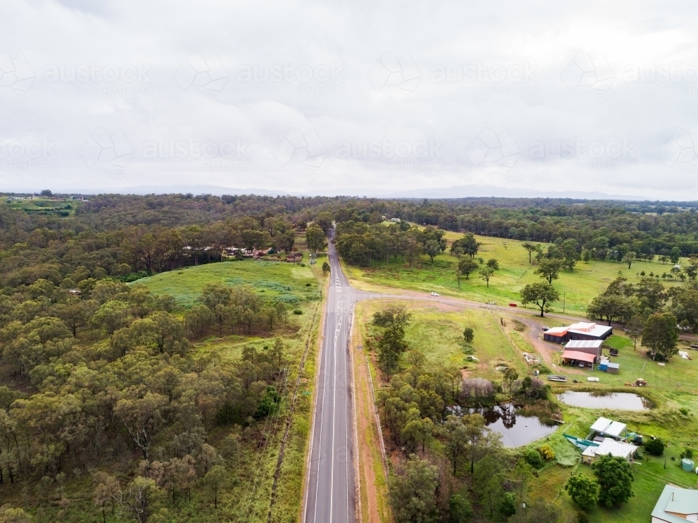 Country road heading out of Singleton on overcast day - Australian Stock Image