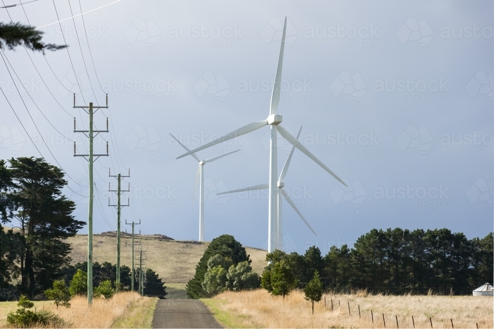 Country road leading through a wind farm - Australian Stock Image