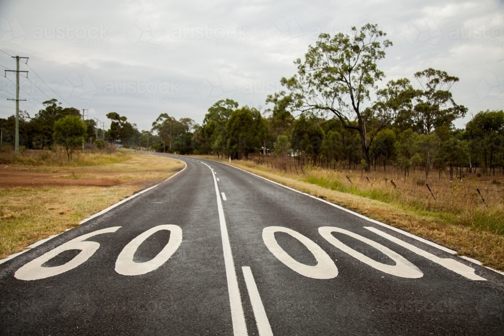 Country road with speed change from one hundred to sixty zone - Australian Stock Image