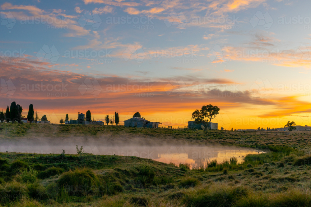 Country silhouettes and a colourful dawn sky - Australian Stock Image