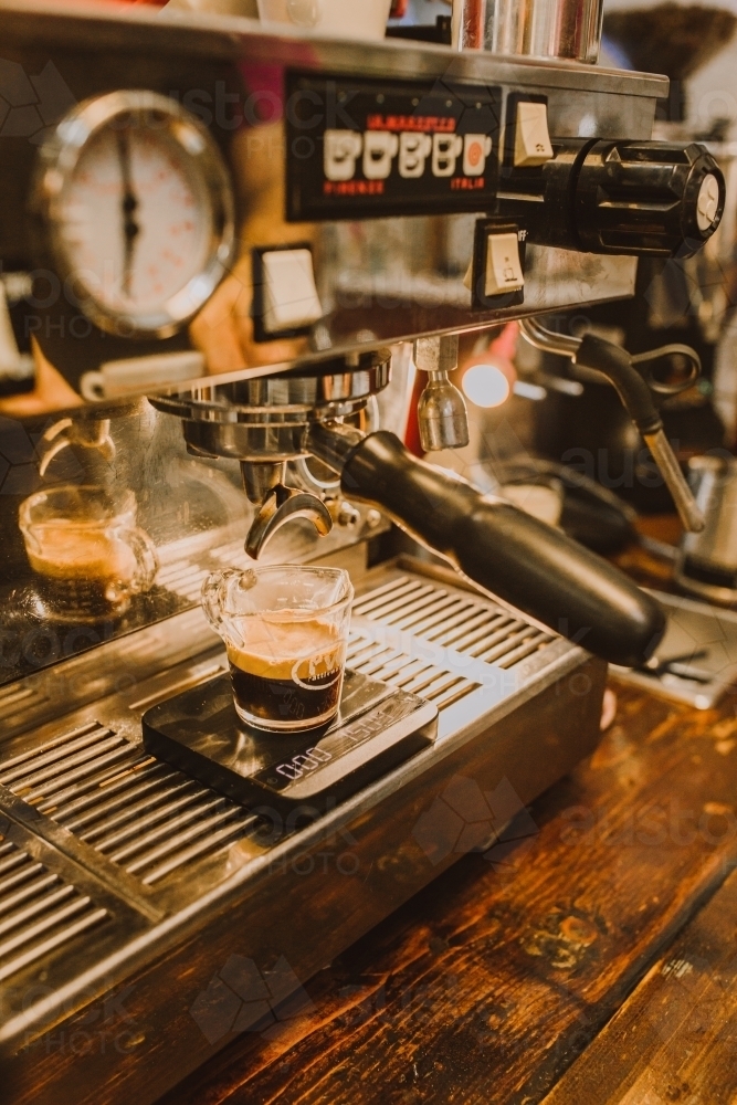 Coupe of double shot of coffee on machine - Australian Stock Image