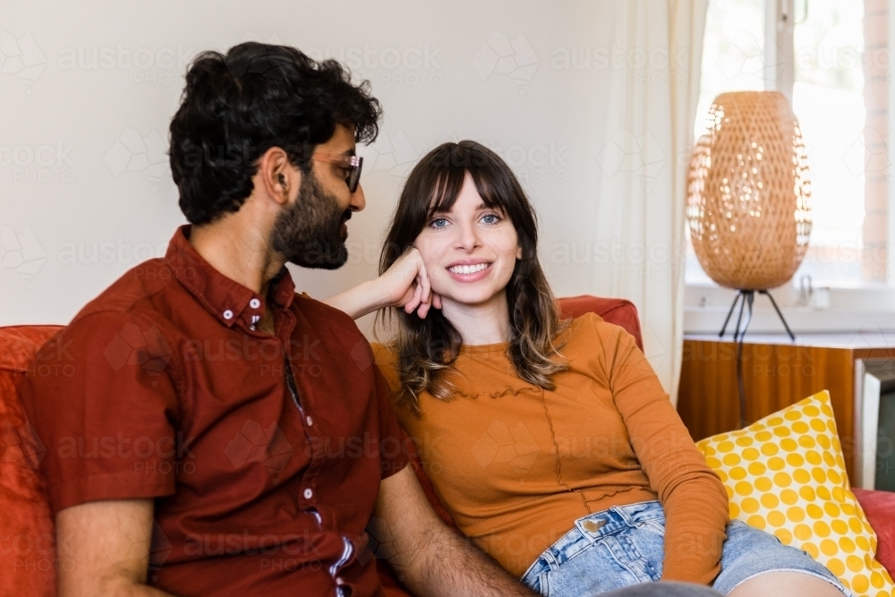 couple at home in living room - Australian Stock Image