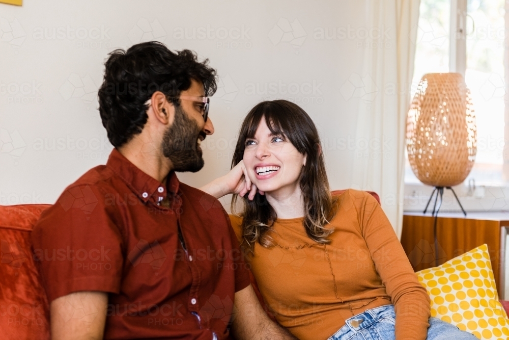 couple at home in living room - Australian Stock Image