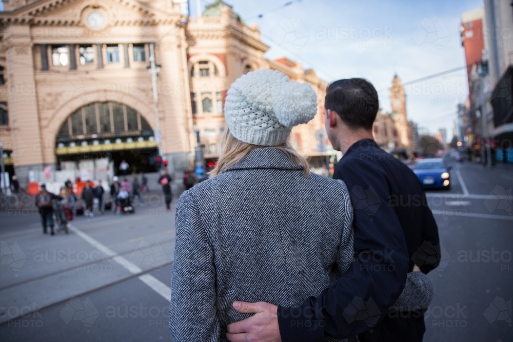 Couple Crossing Flinders Street to the Station - Australian Stock Image