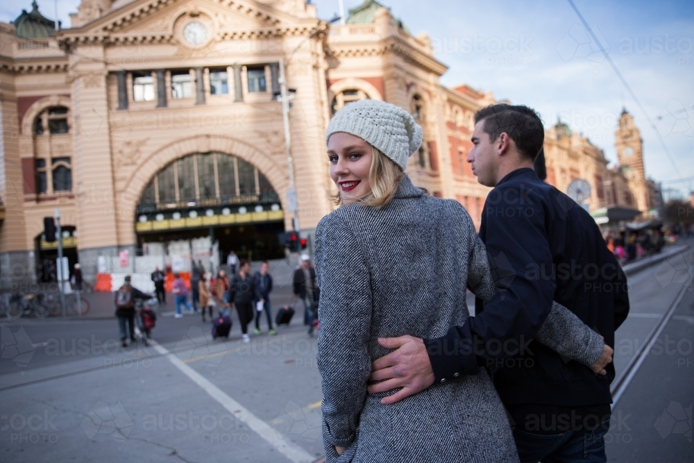 Couple Crossing Flinders Street to the Station - Australian Stock Image