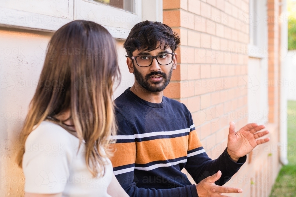 Image of couple in conversation Austockphoto