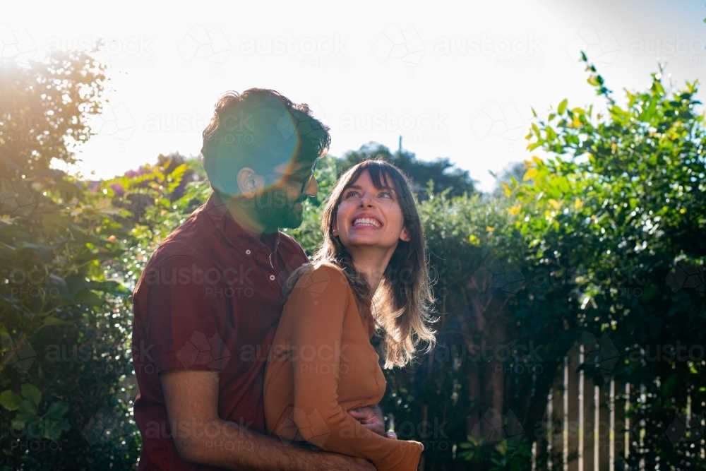 couple outside in their yard - Australian Stock Image