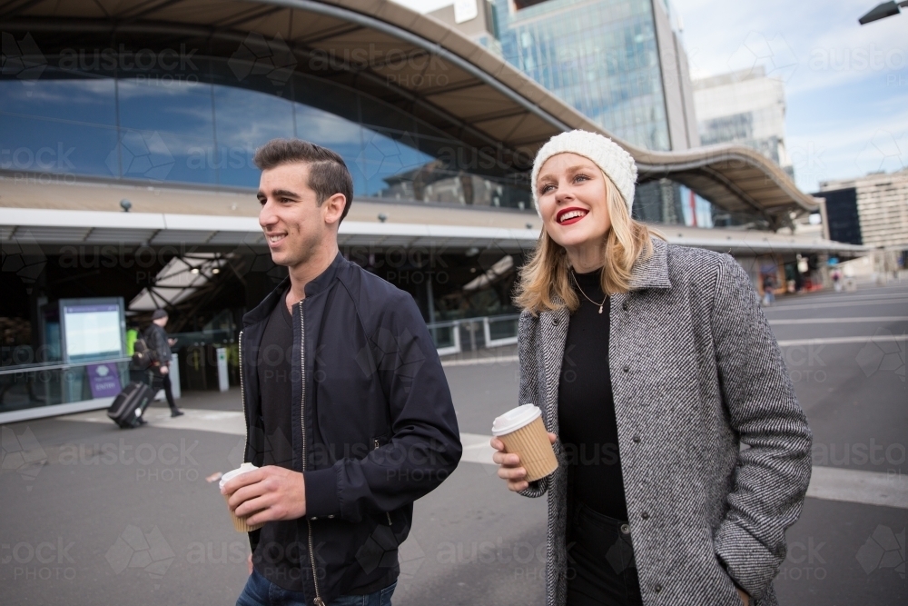 Couple Walking Past Southern Cross Station - Australian Stock Image