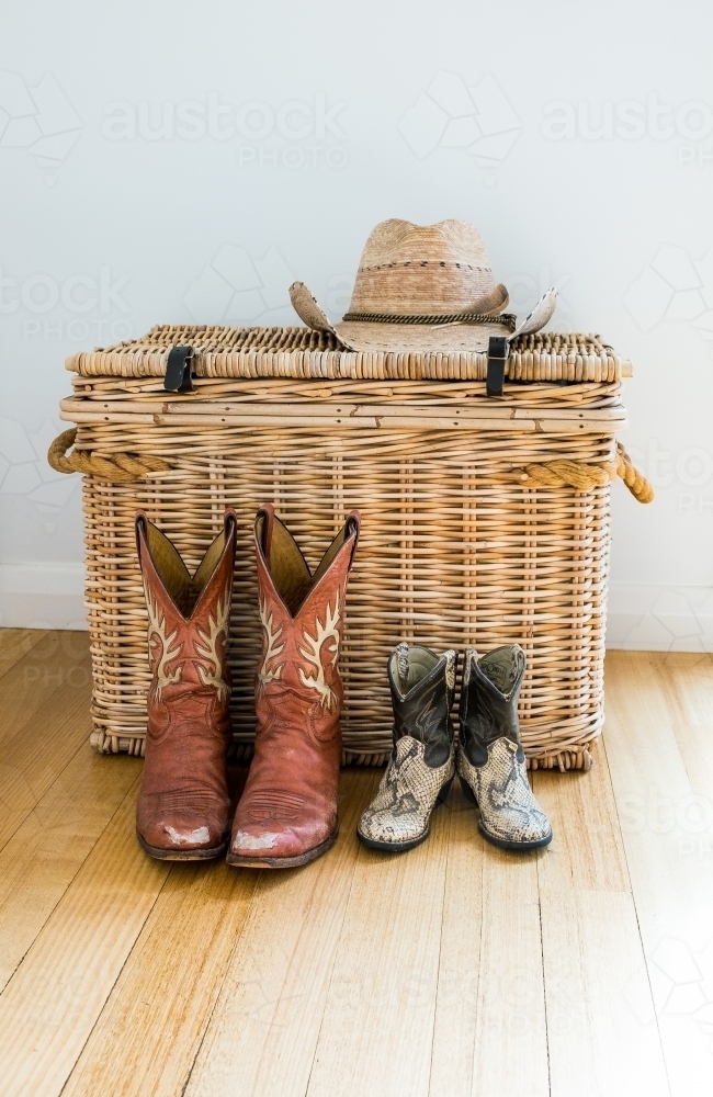 Cowgirl mum and cowboy baby boots waiting to be worn - Australian Stock Image