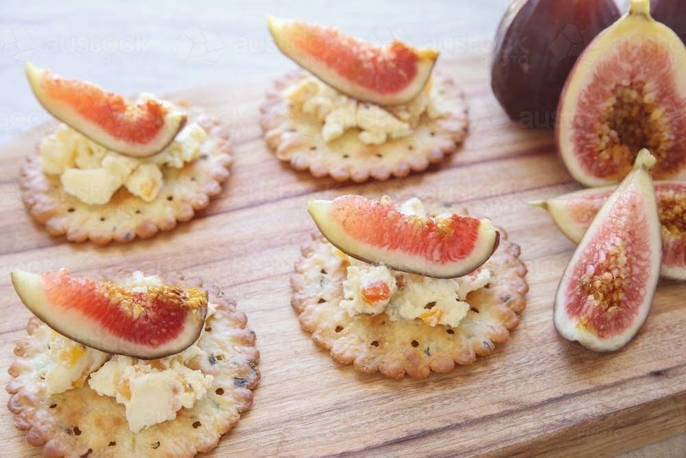 Cracker canapes with fresh fig and cream cheese - Australian Stock Image