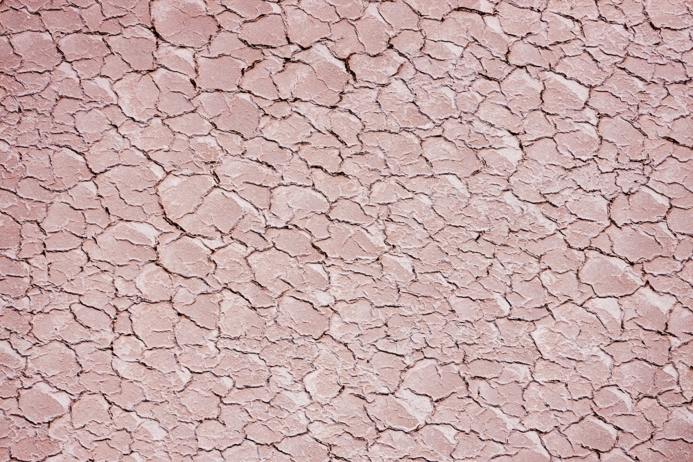 cracks in surface of dry lake bed - Australian Stock Image