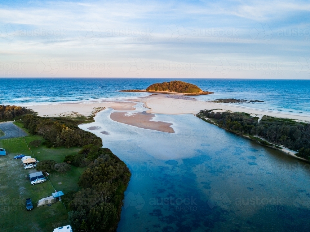 Crampton Island and the outlet of Tabourie creek at dusk - Australian Stock Image
