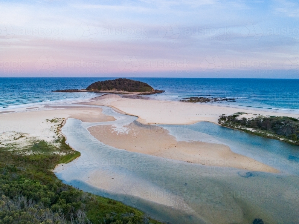 Crampton Island and the outlet of Tabourie creek at dusk - Australian Stock Image