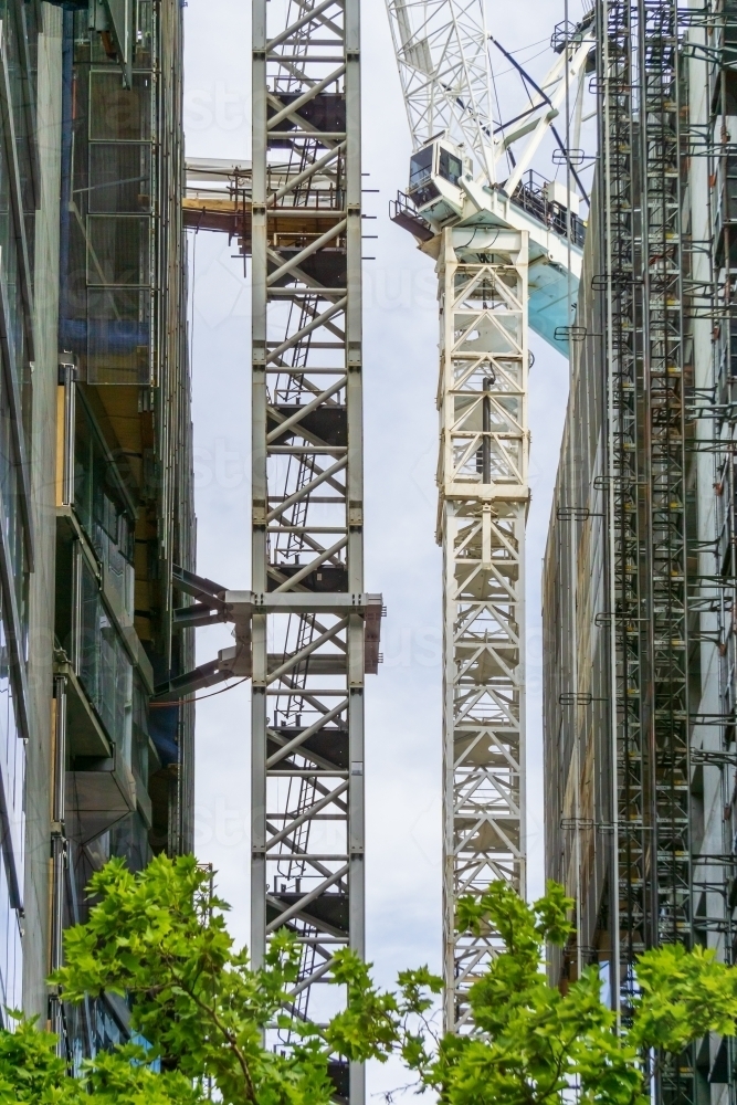 Crane scaffolding between two buildings under construction - Australian Stock Image