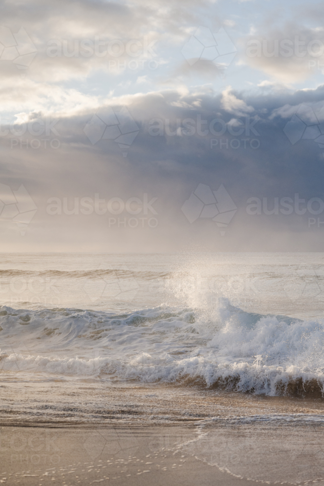 crashing waves at sunrise - Australian Stock Image