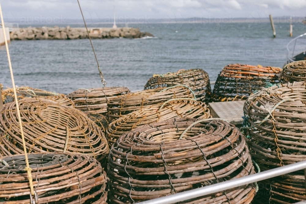 Image of Crayfish pots on a commercial fishing boat at a wharf beside ...