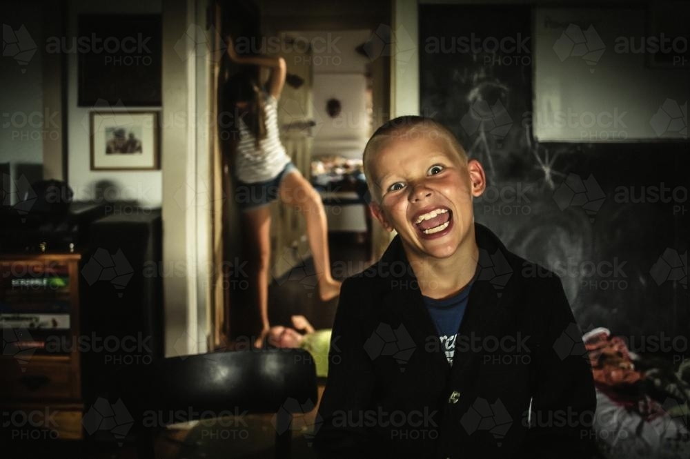 Crazed siblings at home - Australian Stock Image