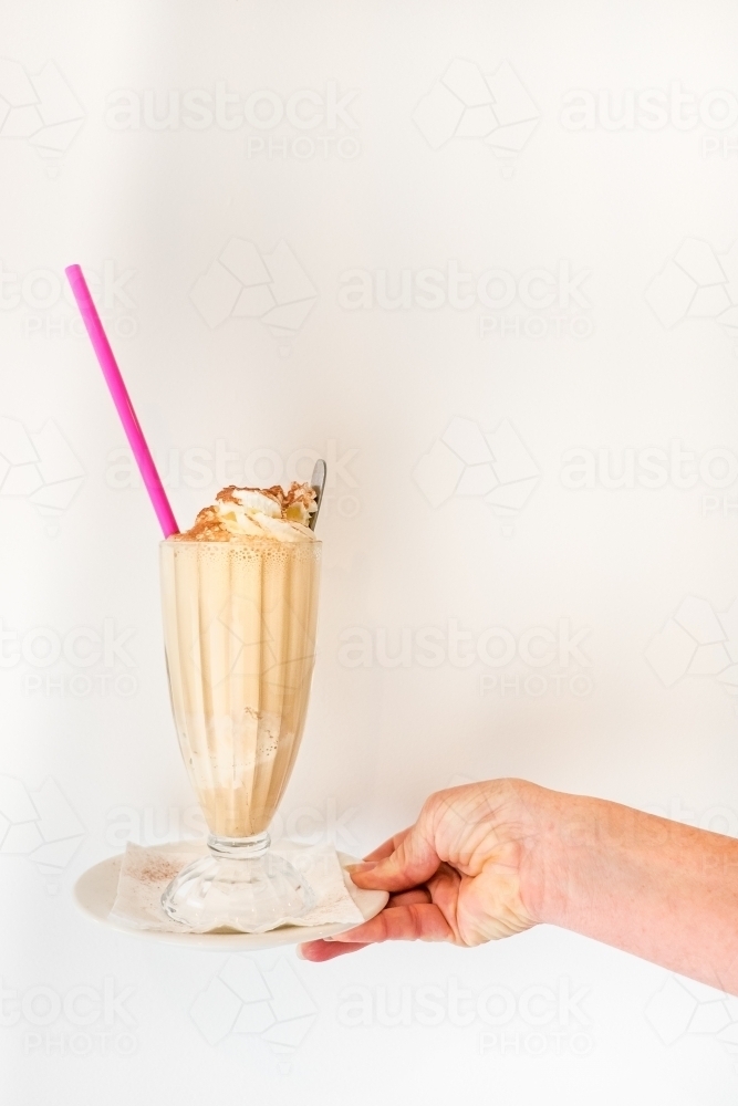 Creamy iced coffee ready to drink. - Australian Stock Image