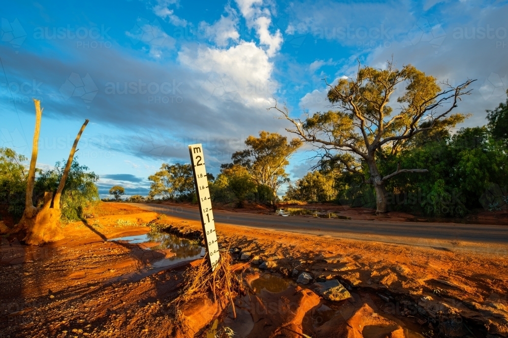 Creek crossing with water level sign - Australian Stock Image