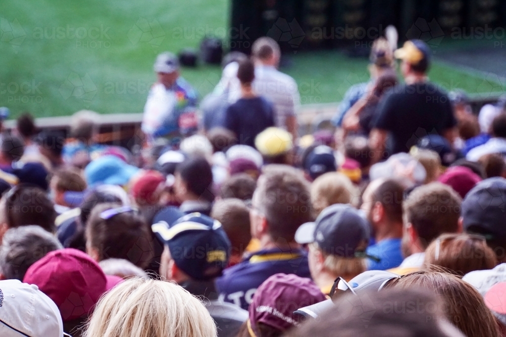 Crowded heads at football game - Australian Stock Image