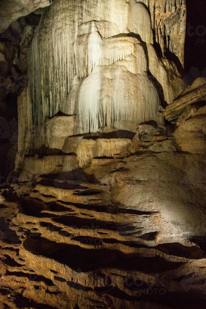 Crystal stalactite rock formation in Cathedral Cave at Wellington - Australian Stock Image