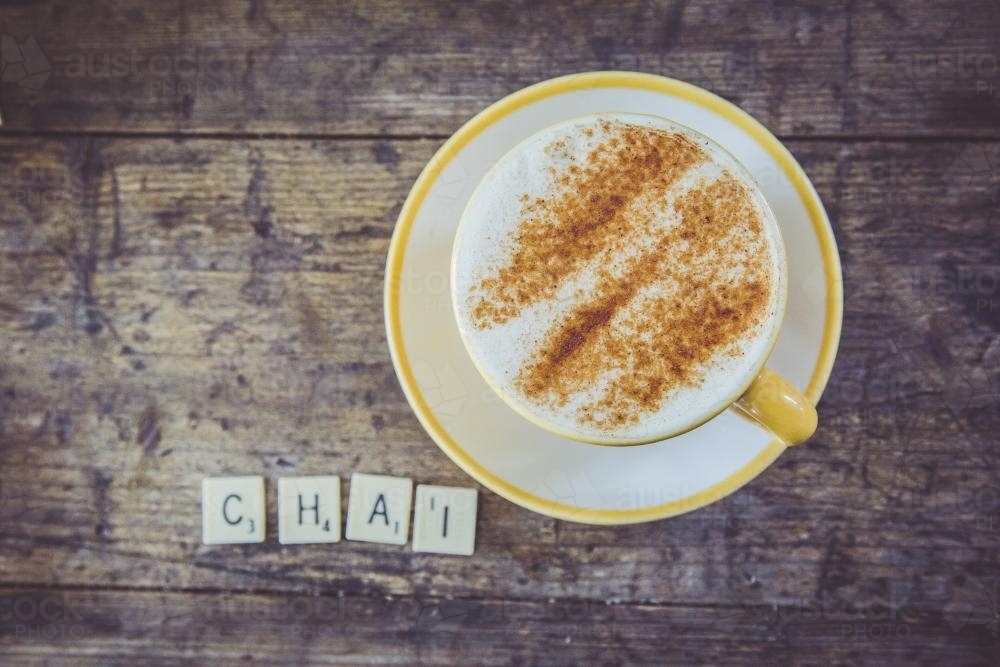 Cup of chai with scrabble letters - Australian Stock Image
