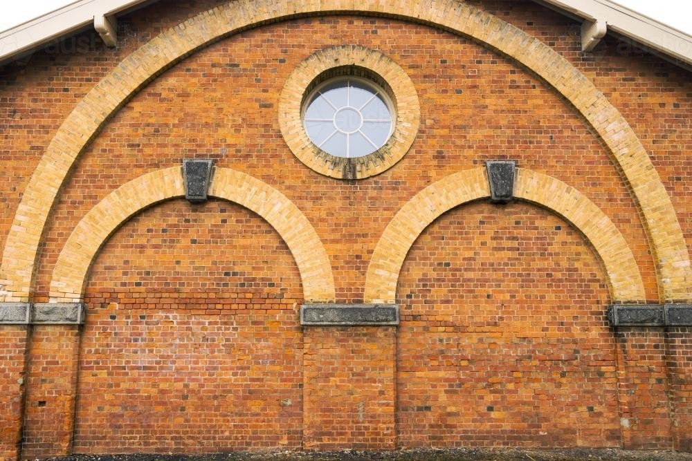 Curved brickwork and arches on a building - Australian Stock Image