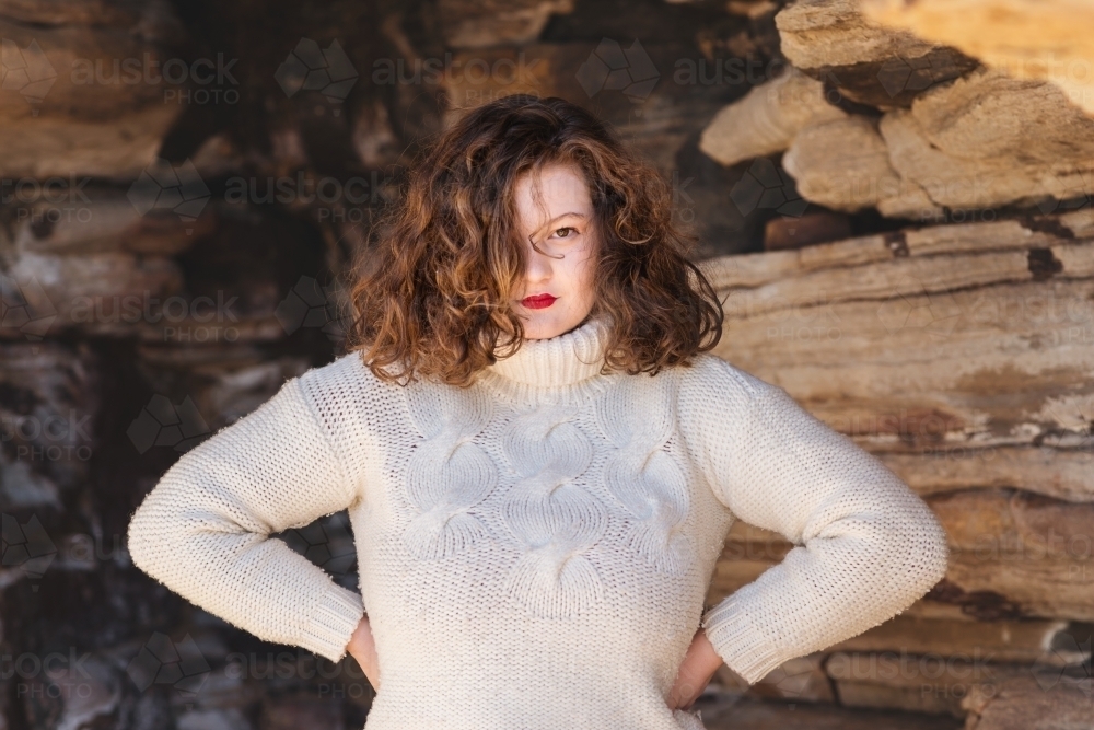 curvy woman wearing white sweater - Australian Stock Image
